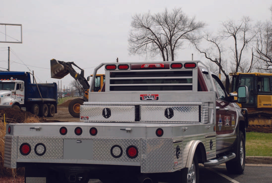 Truck with aluminum diamond plated drawers across bed