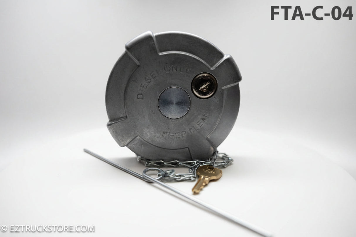 Gray fuel cap with chain and key on a white background