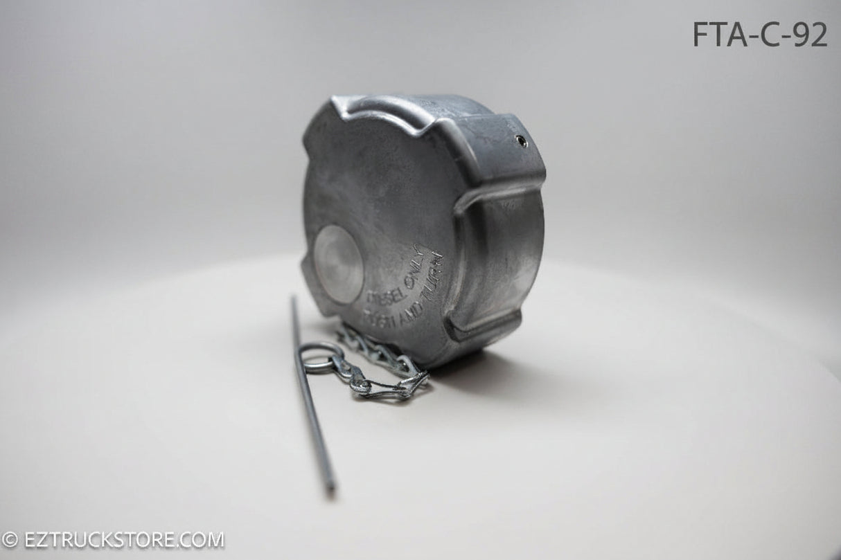 Aluminum fuel cap with chain on a white background