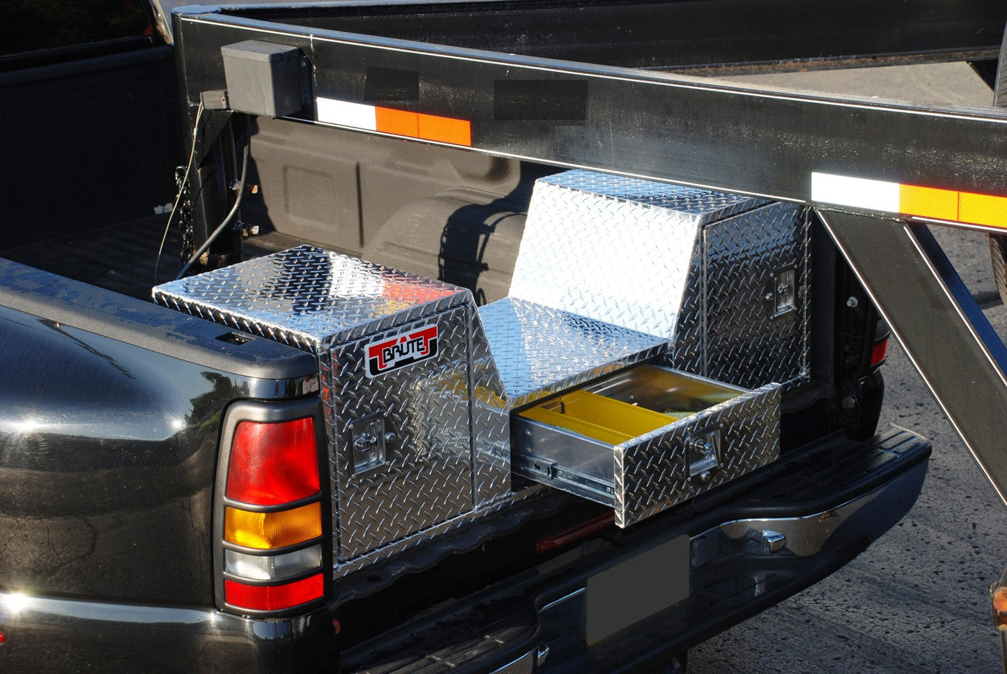 truck with V neck tool box installed in polished aluminum