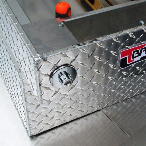 close up of push button lock on gullwing tool box by Brute