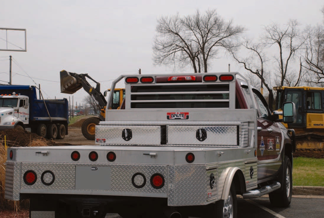Truck with aluminum diamond plated drawers across bed