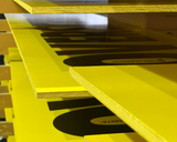 Yellow shelf with black labels on a white background