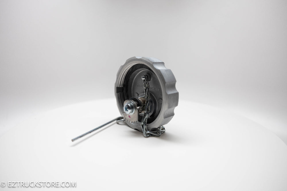 FTA-C-76 Locking fuel cap under side picture showing locking mechanism and chain