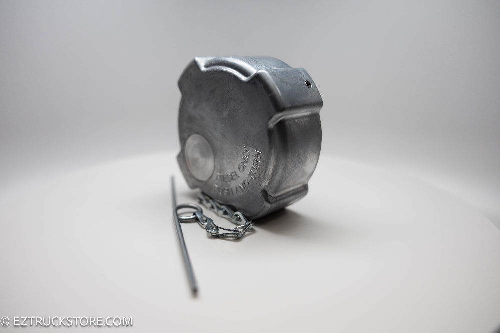 Aluminum fuel cap with chain on a white background