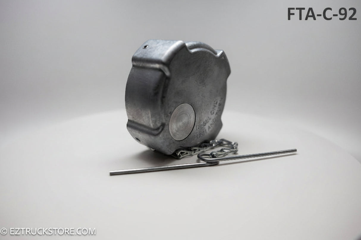 Aluminum fuel cap with chain on a white background with chain