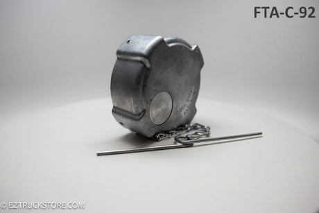 Aluminum fuel cap with chain on a white background with chain