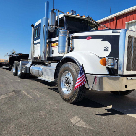 ez mount american flag mounted on bumper of a truck