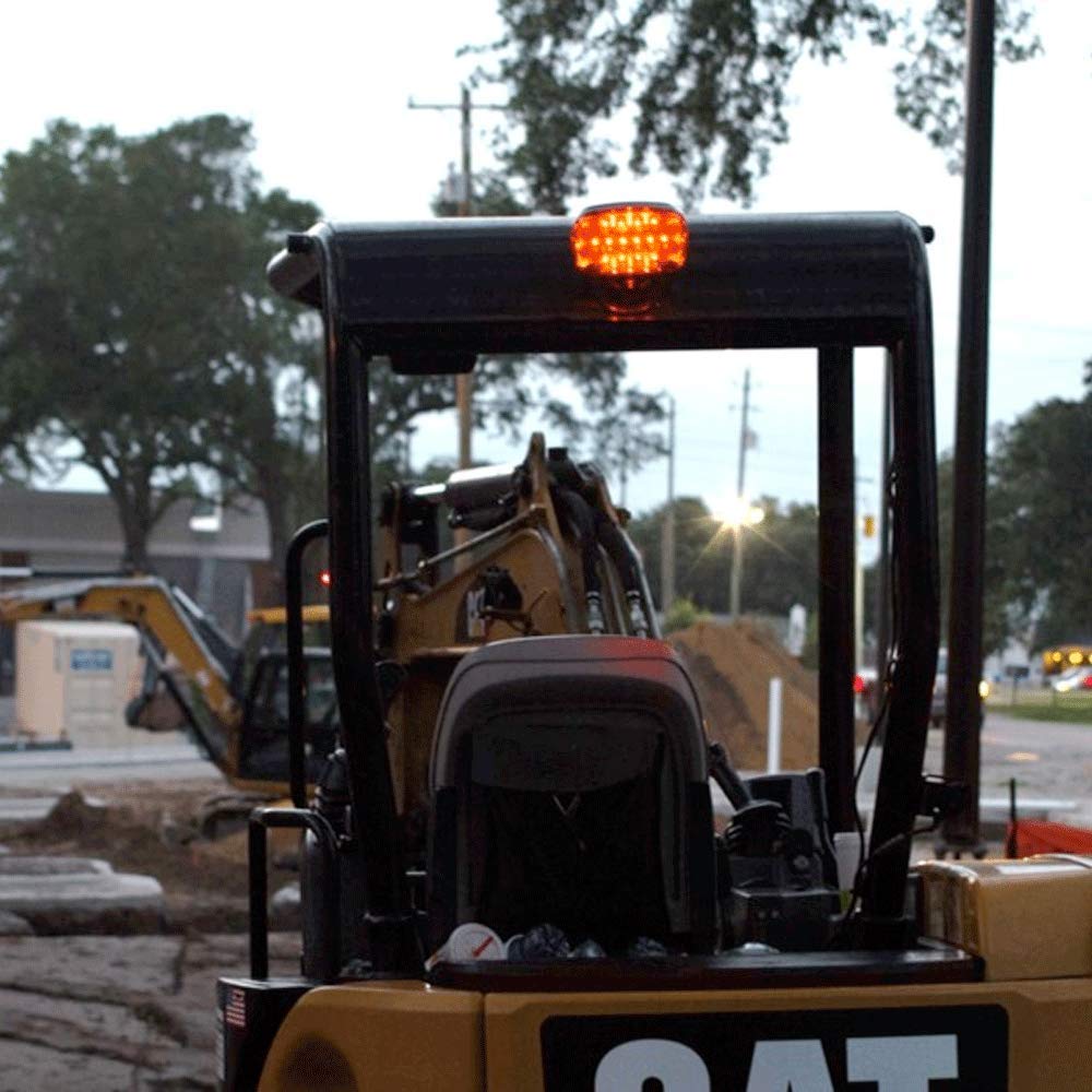 FoxFire Light mounting kit in use on CAT back hoe