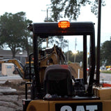 FoxFire Light mounting kit in use on CAT back hoe