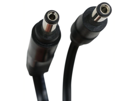 Black DC power cable with connectors on a white background