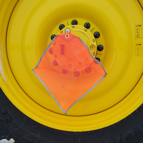 max duty truck safety flag being used with flag mag on rim of tire