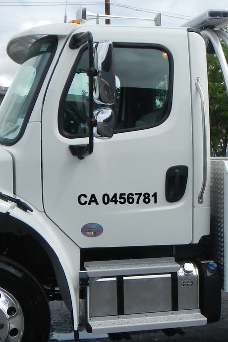 white truck with CA Number Decal on the side