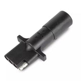 A black 4-way round to 4-way flat pin adapter for vehicle lighting systems.