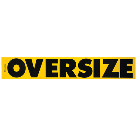 An oversized road sign with black lettering, constructed from wood, stating 'Oversize'.