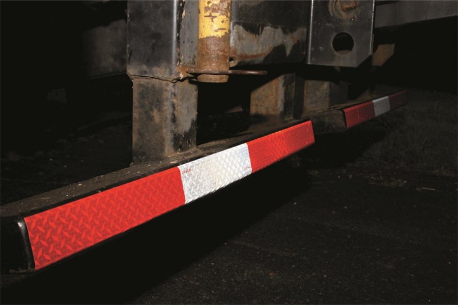 
                  
                    red white reflective conspicuity tape in use on bottom of trailer
                  
                