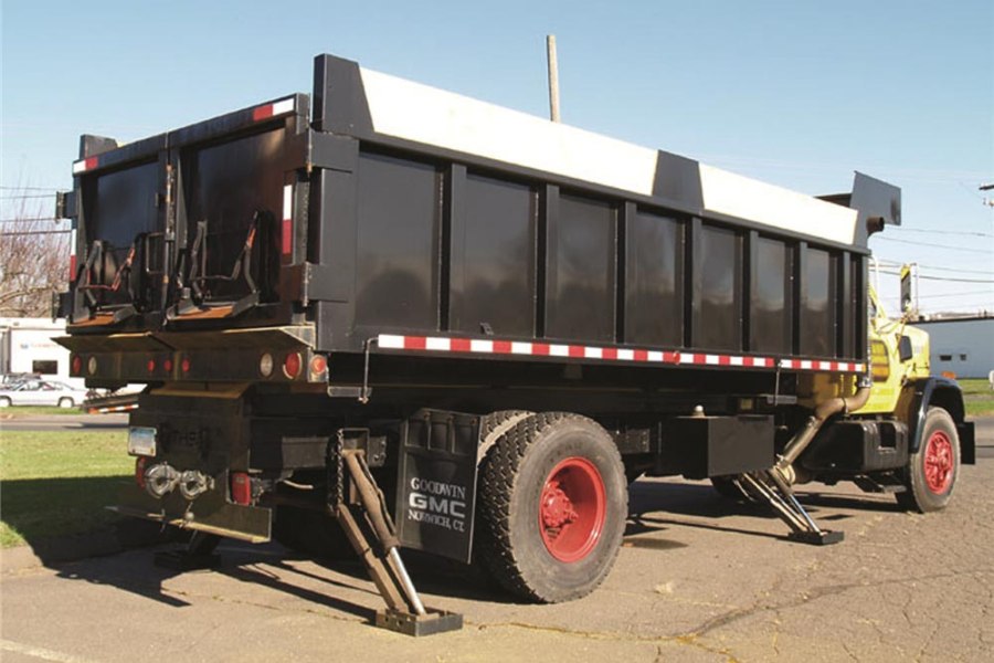 
                  
                    red white reflective conspicuity tape in use on dump truck
                  
                